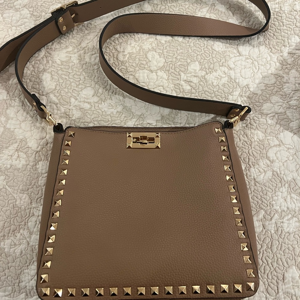 Taupe leather Crossbody handbag with gold studs.